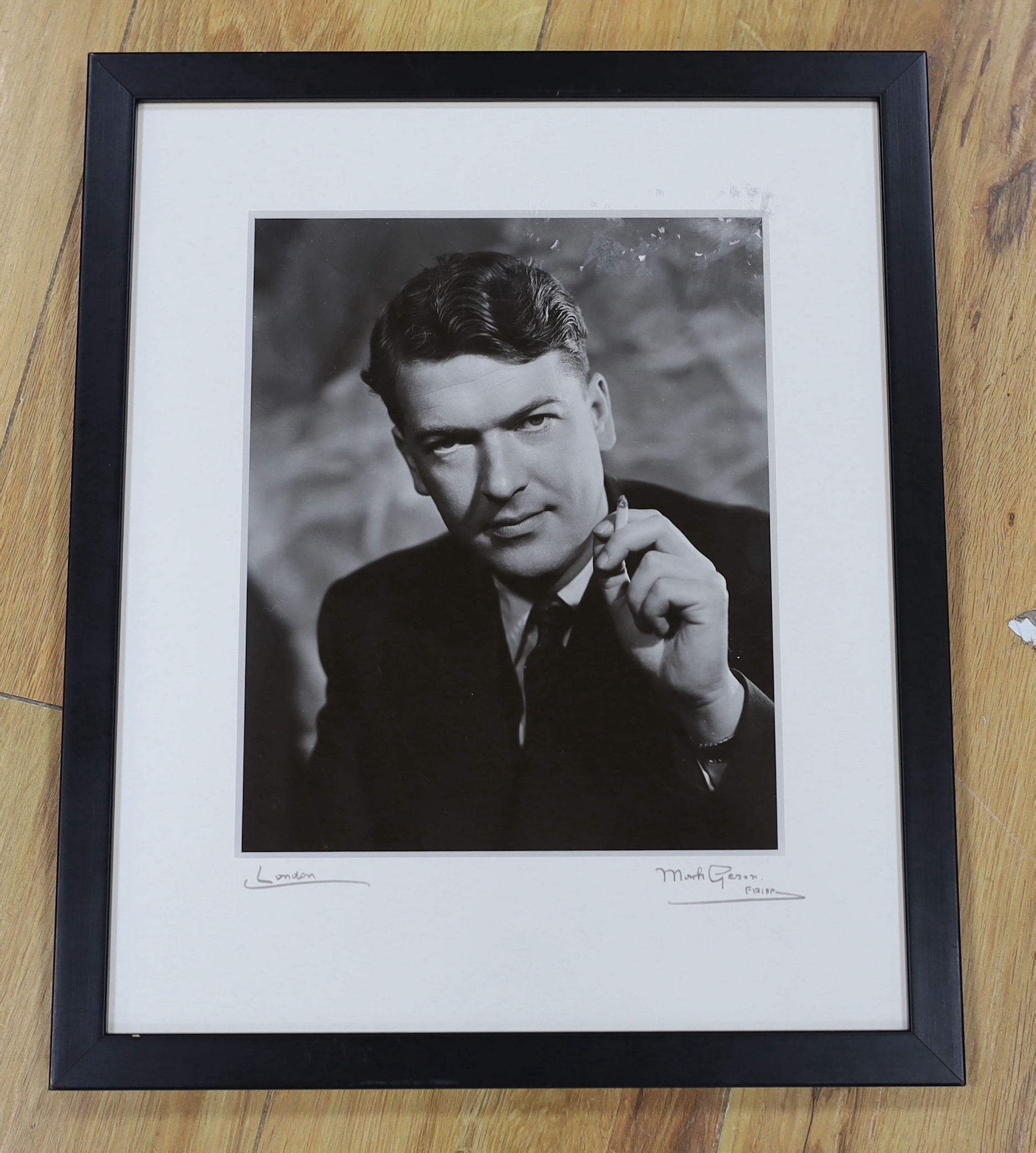 Mark Gerson, (b.1921). A vintage black and white photograph, Portrait of Kingsley Amis, signed by the photographer to the mount, together with Bonham's catalogue, 24 x19cm